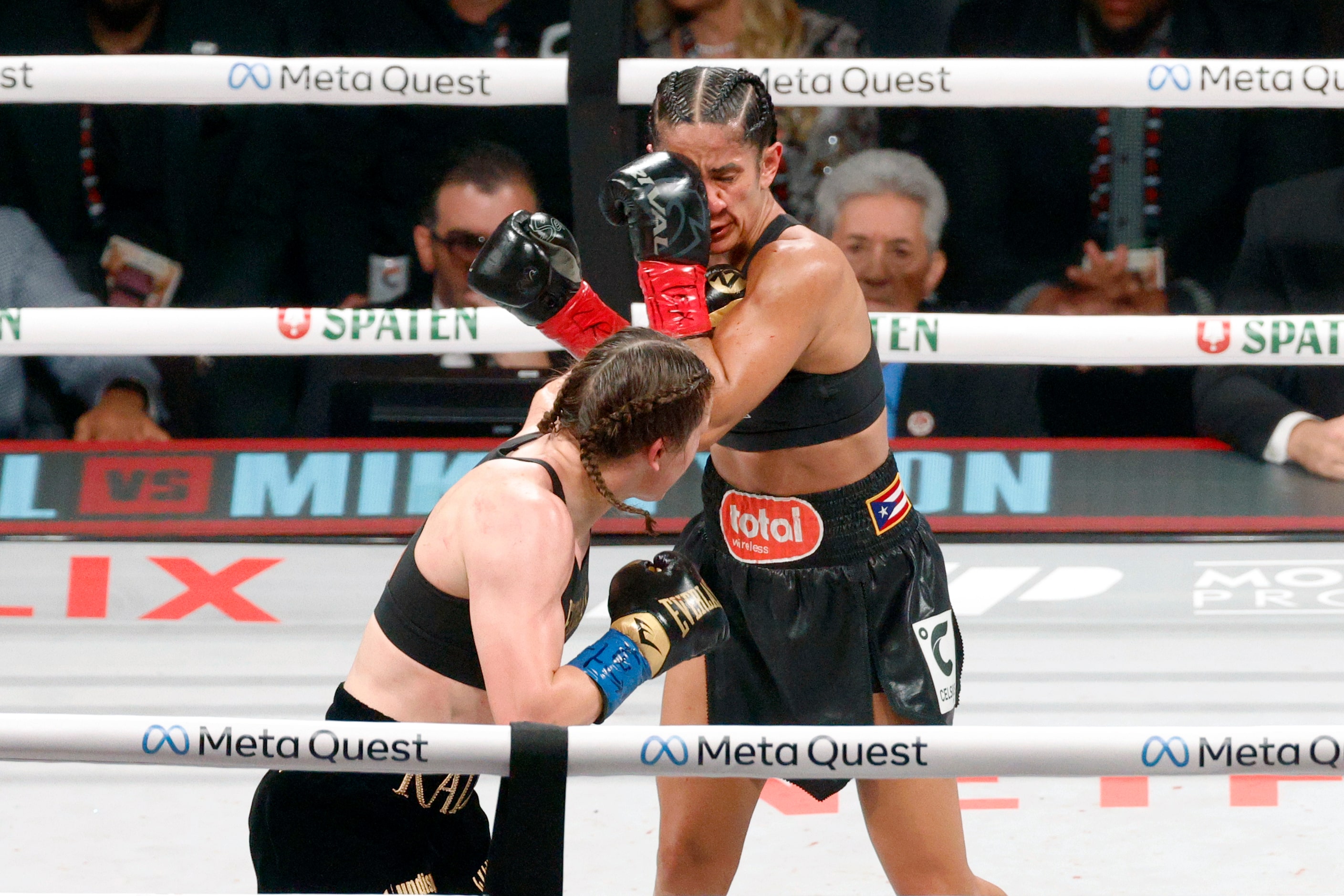 Amanda Serrano takes a punch from Katie Taylor during round seven of the undisputed super...