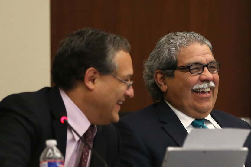 Board president Edwin Flores (left) and Superintendent Michael Hinojosa shared a laugh...