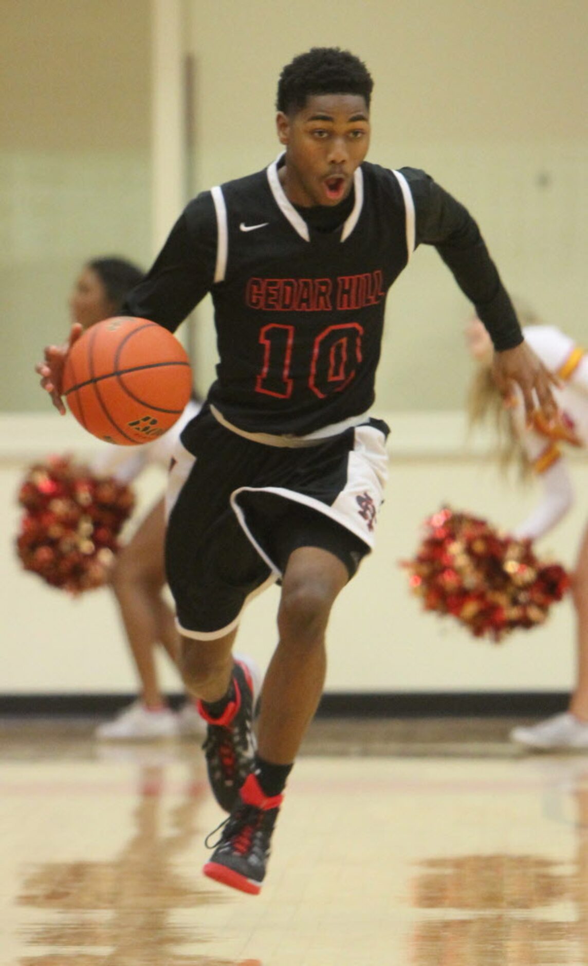 Cedar Hill guard Russhard Cruickshank (10) races down the court during a first half fast...