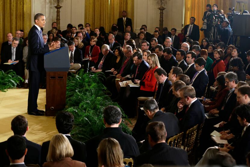 President Barack Obama answers a question during a news conference in the East Room of the...