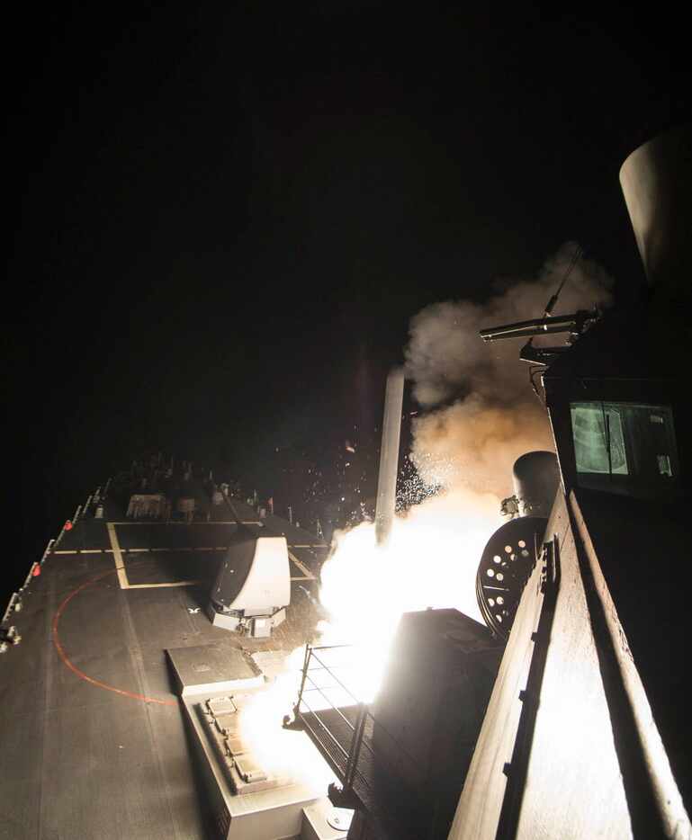 In this image provided by the U.S. Navy, the USS Ross (DDG 71) fires a tomahawk land attack...