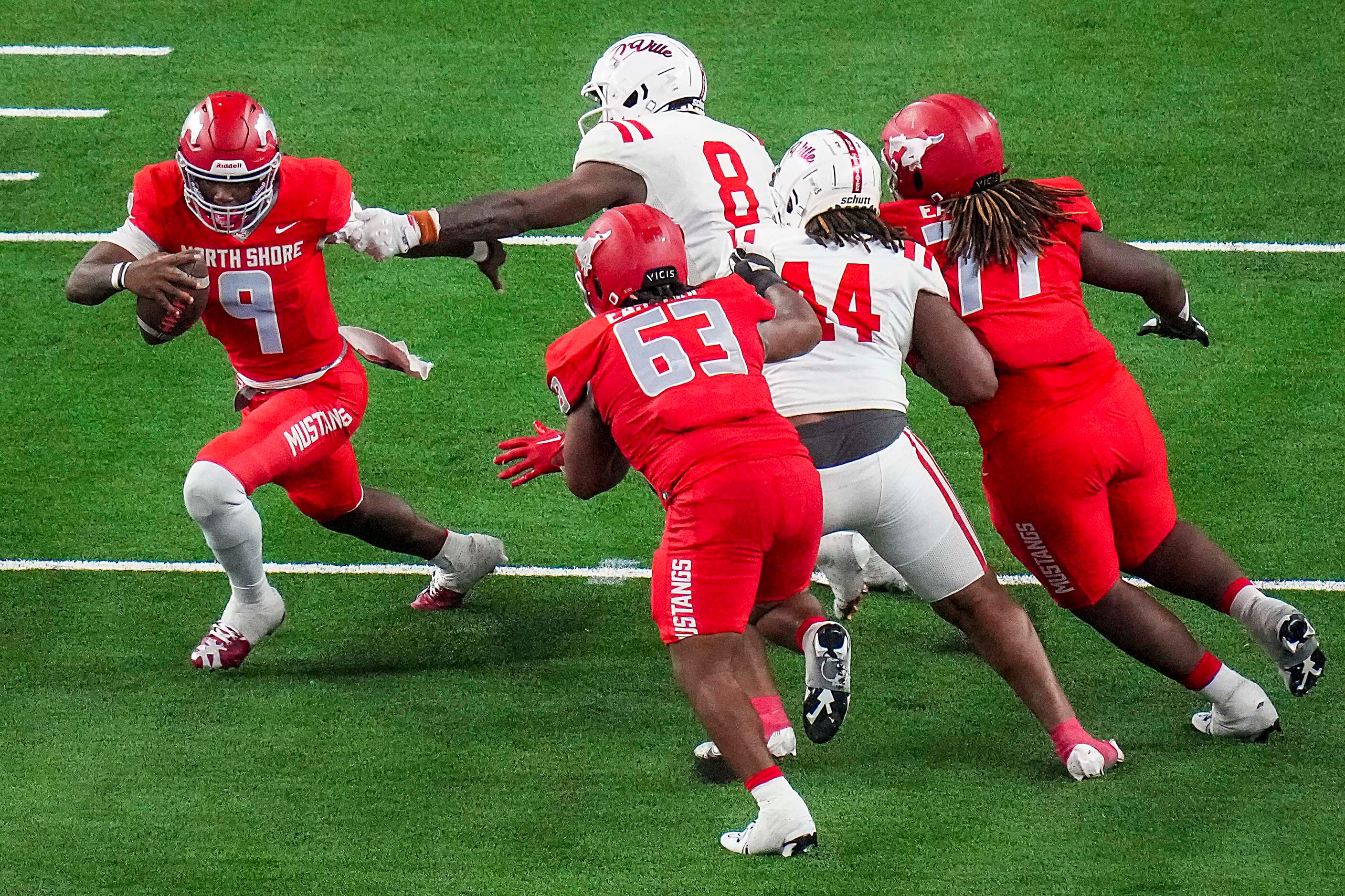 Galena Park North Shore quarterback Kaleb Bailey (9) is pursued by Duncanville’s Colin...