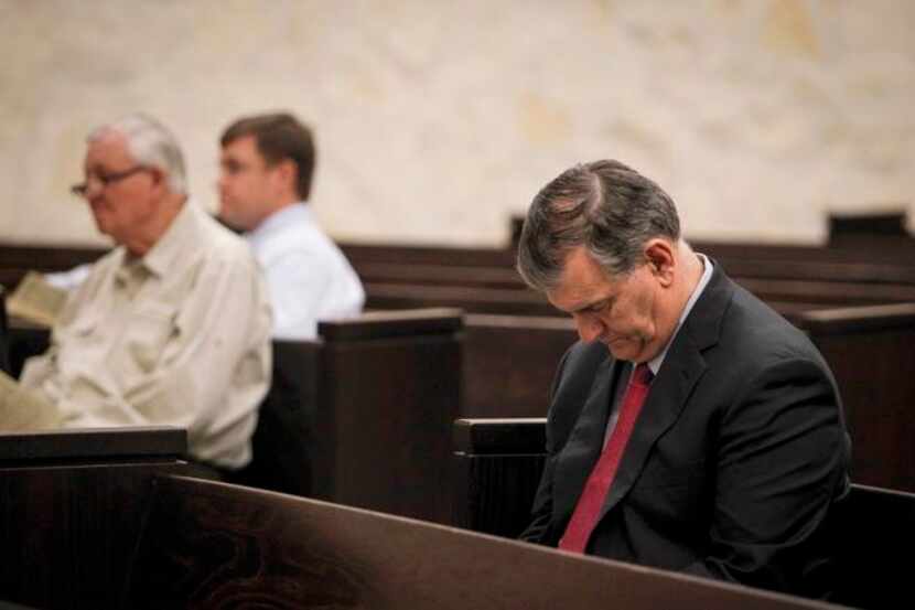 
Dallas Mayor Mike Rawlings bowed his head during a special vigil service for those affected...