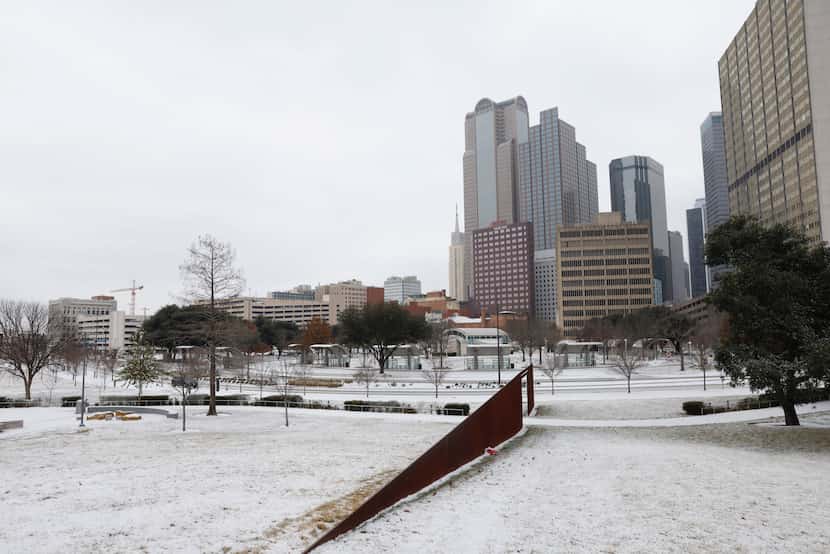 Snow covers the ground at Carpenter Park in downtown Dallas, Monday, Jan. 15, 2024.