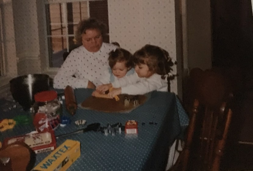 Nancy McCall (left), Nanette Light's grandmother, watches as Light (right), age 3, cuts out...