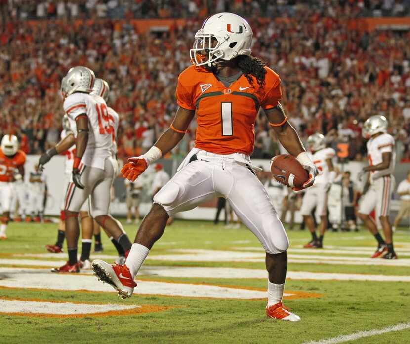 Miami wide receiver Allen Hurns celebrates in the end zone following a touchdown against...