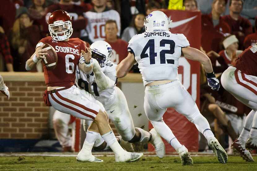 Oklahoma quarterback Baker Mayfield (6) is sacked by TCU defensive tackle L.J. Collier (91)...