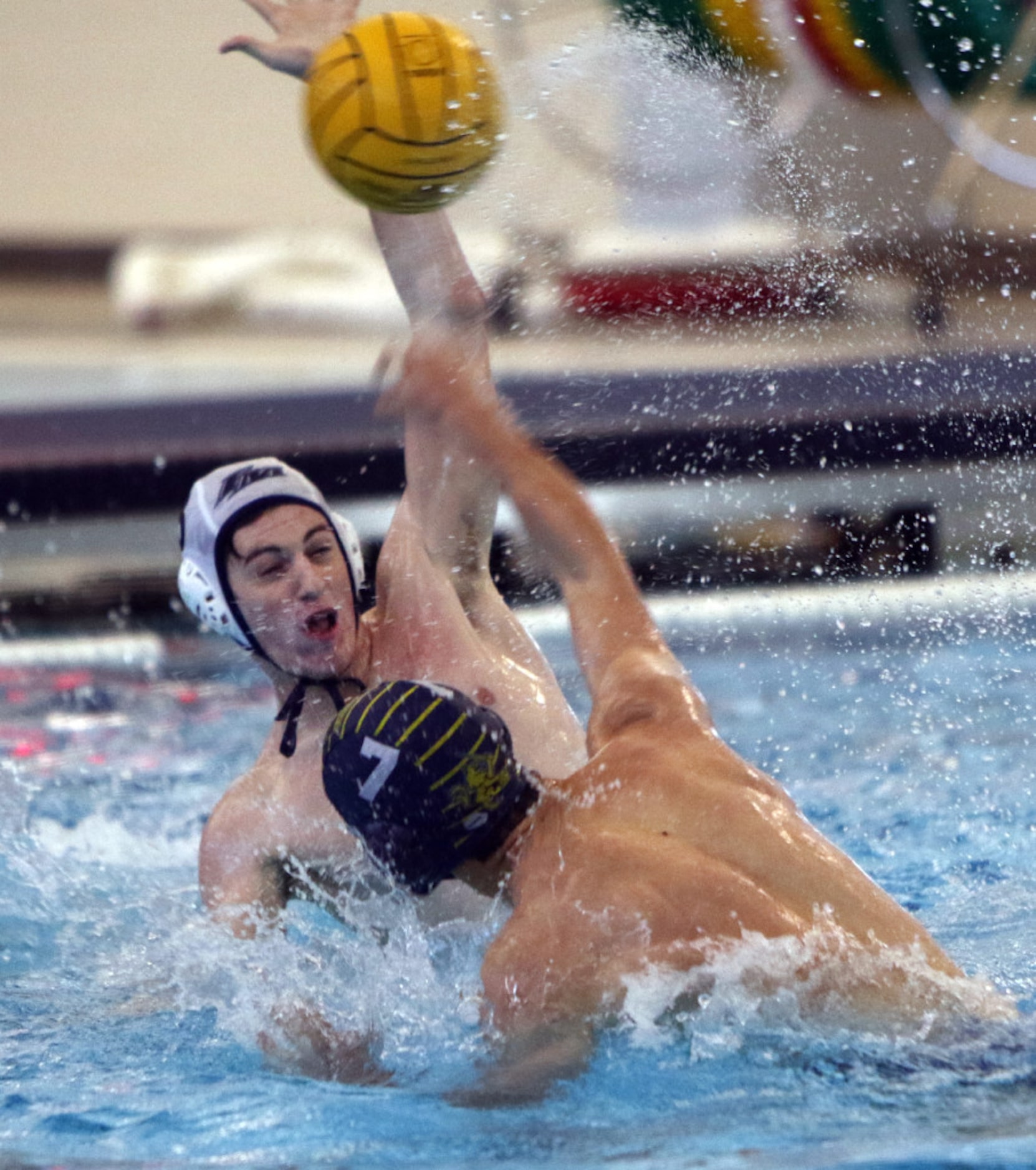 Andrew Lin (7, right) of St Mark's powers the ball past Flower Mound defender Will Morris...