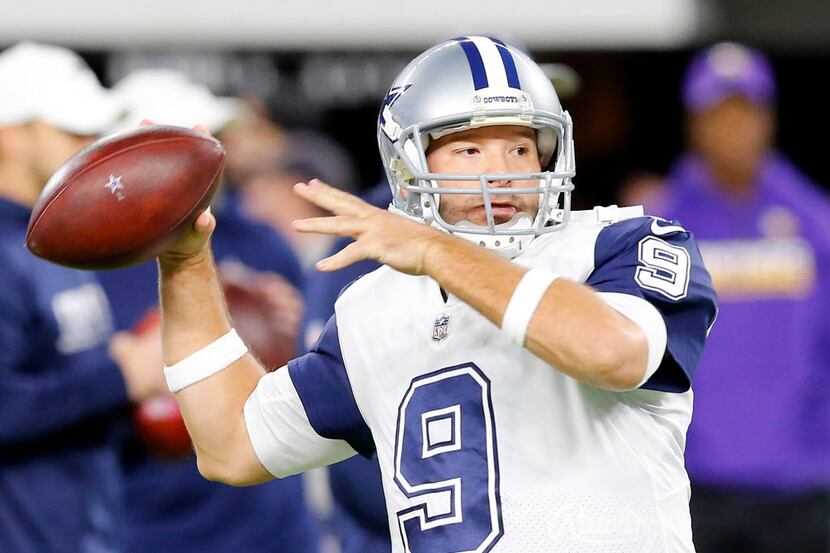Dallas Cowboys quarterback Tony Romo (9) throws during pregame wamups before facing the...