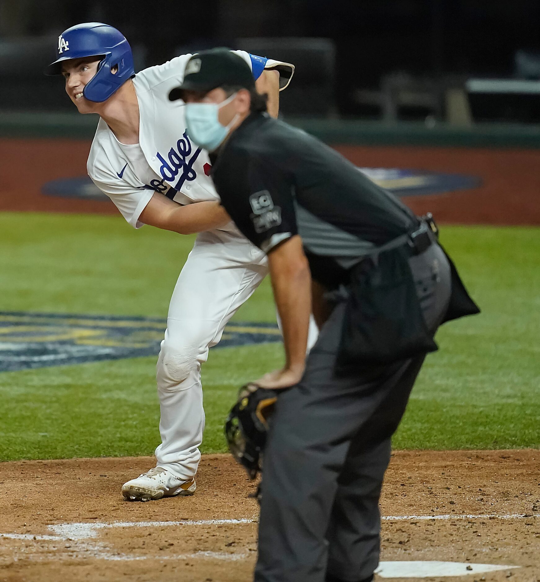 Los Angeles Dodgers designated hitter Joc Pederson and umpire James Hoye watch as his deep...