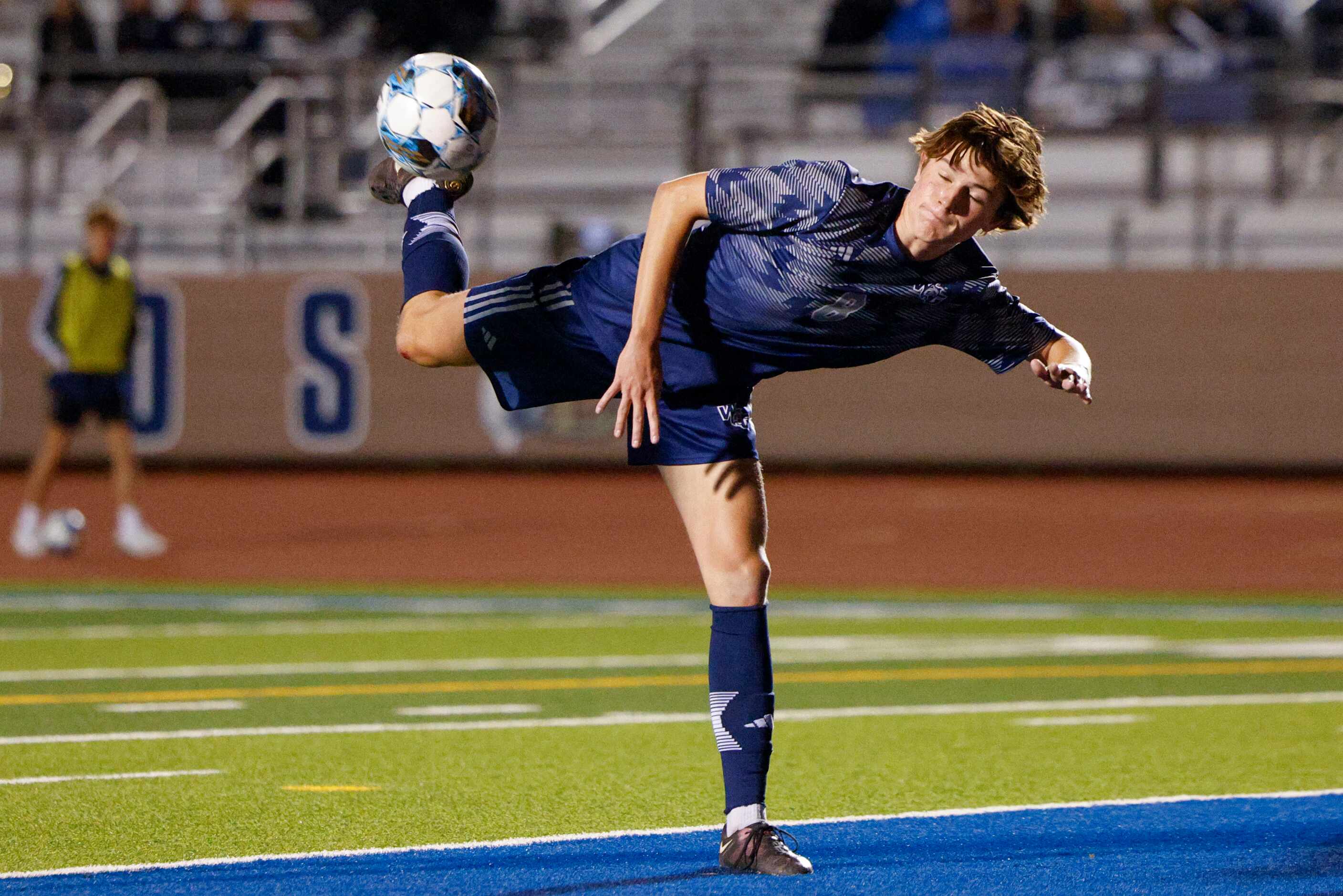 Prosper Walnut Grove midfielder Mason Kutch (8) reaches back to try and kick the ball during...