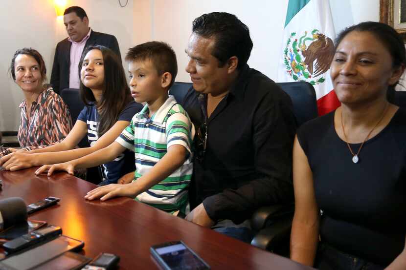 Alondra Luna Nunez, second from left, attends a press conference with her parents, right,...