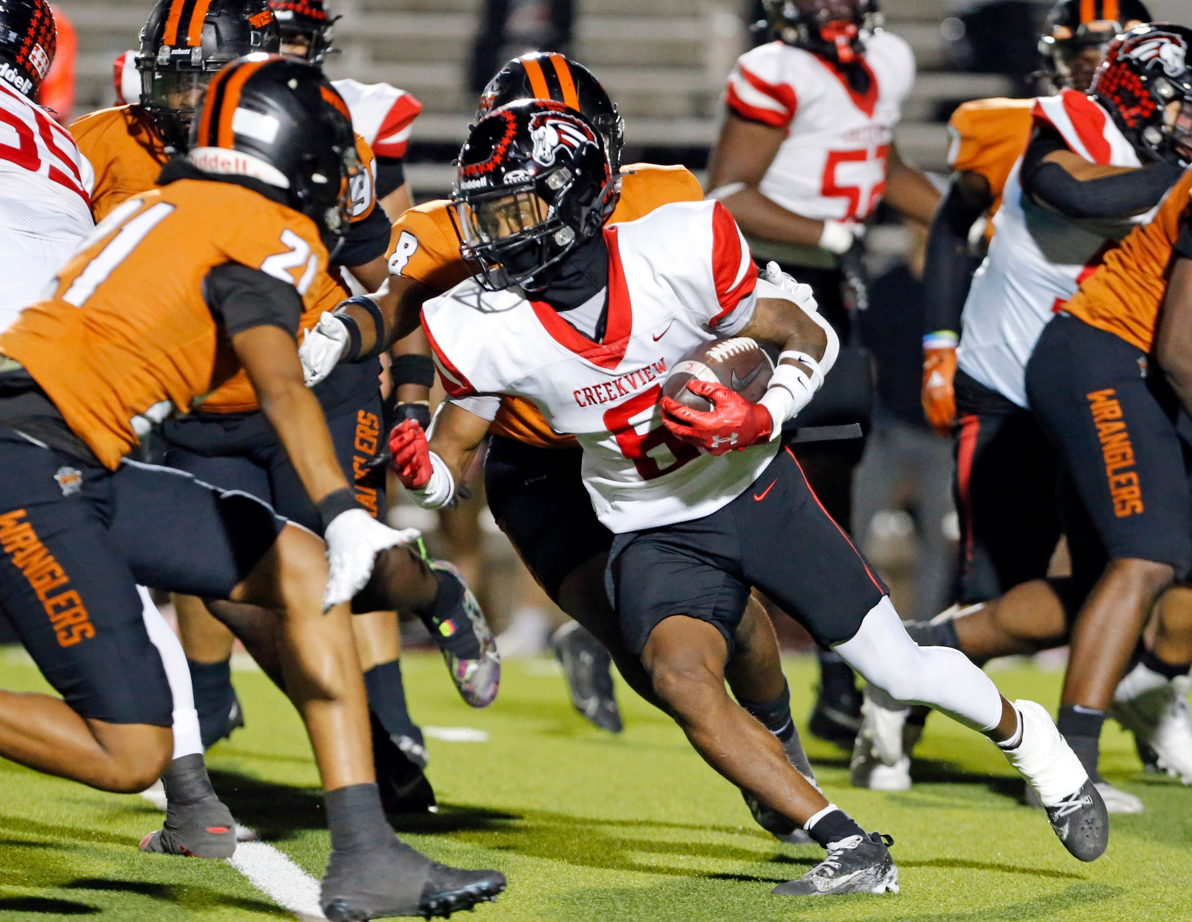 Carrollton Creekview High RB Jonah Drumgole (6) runs for a couple of yards during the first...