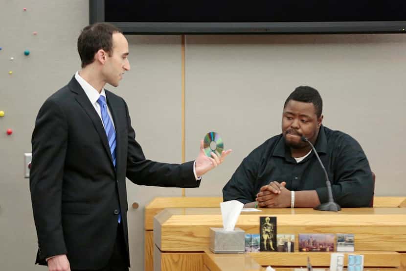 
Prosecutor Jason Fine shows Gary Jackson a recording of a 911 call he made after an...