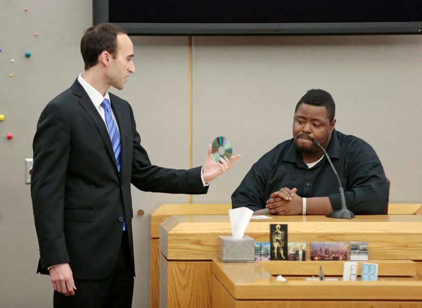 
Prosecutor Jason Fine shows Gary Jackson a recording of a 911 call he made after an...