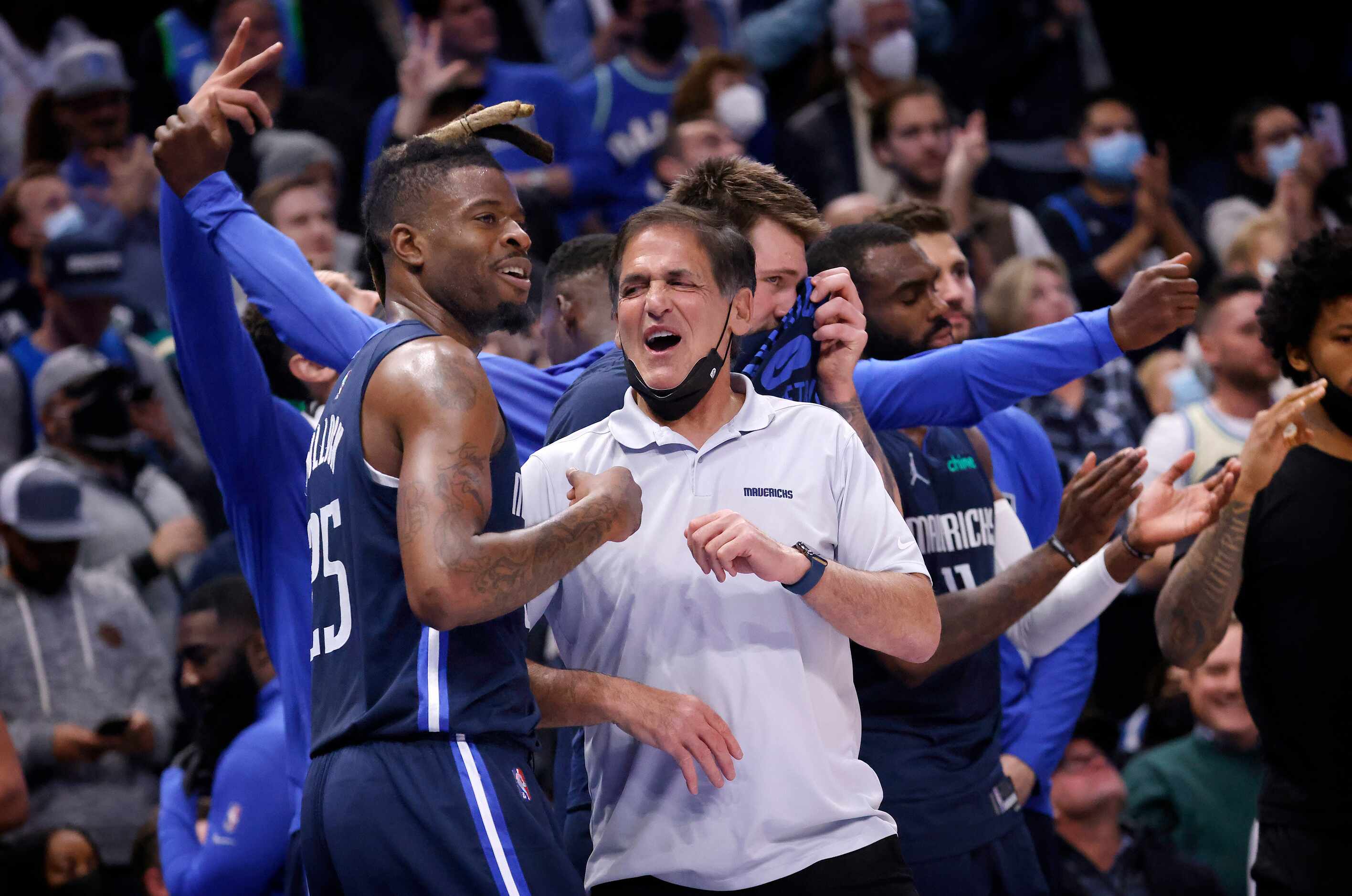 Dallas Mavericks owner Mark Cuban celebrates the teams win over the Golden State Warriors...