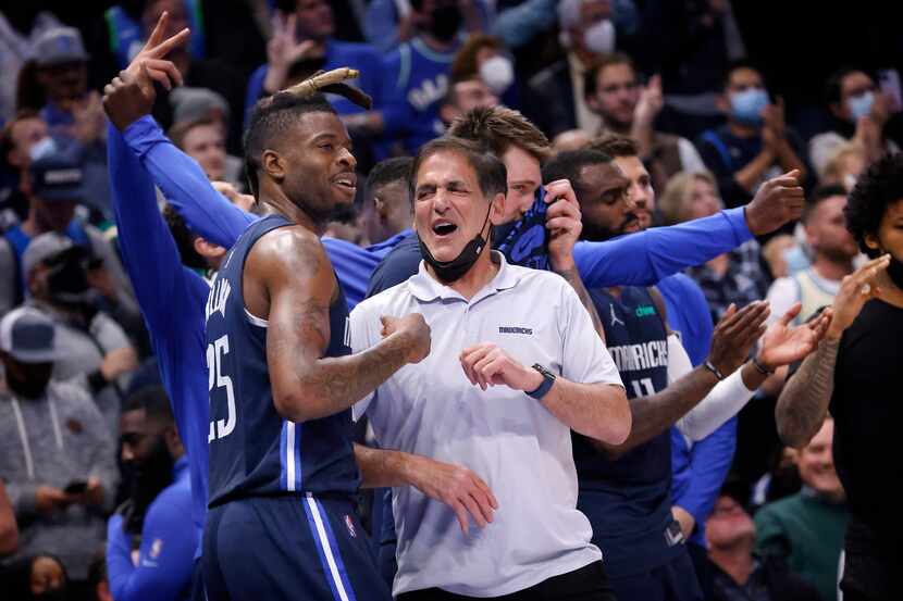 Dallas Mavericks owner Mark Cuban celebrates the teams win over the Golden State Warriors...