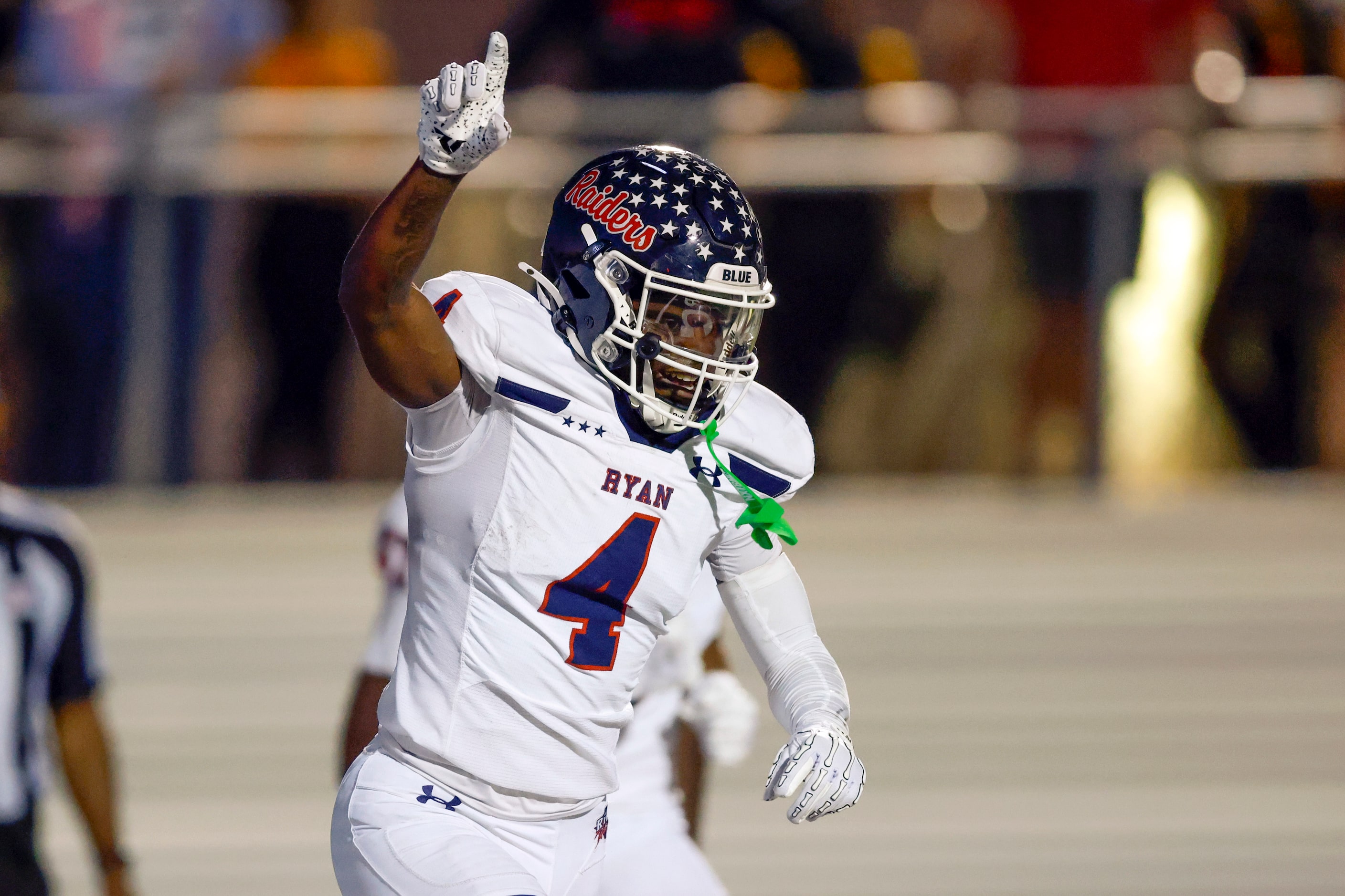 Denton Ryan running back Tre'Vaughn Reynolds (4) celebrates after a 39 yard touchdown...