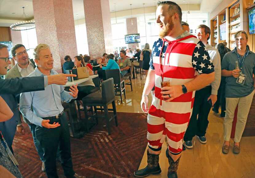 31-year-old Raz Shafer of Fort Worth wears an American flag 'onesie' jumpsuit and draws the...