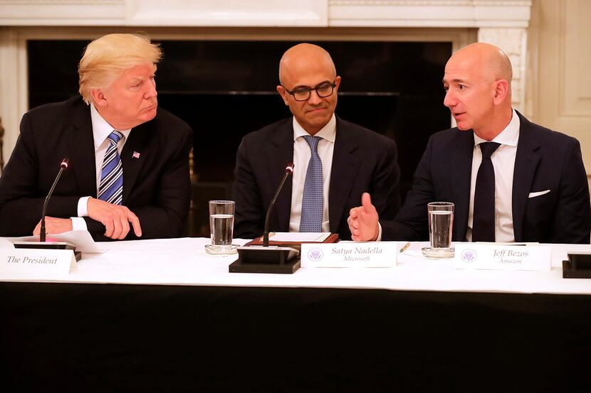 From left: President Donald Trump, Microsoft CEO Stya Nadella and Amazon CEO Jeff Bezos...