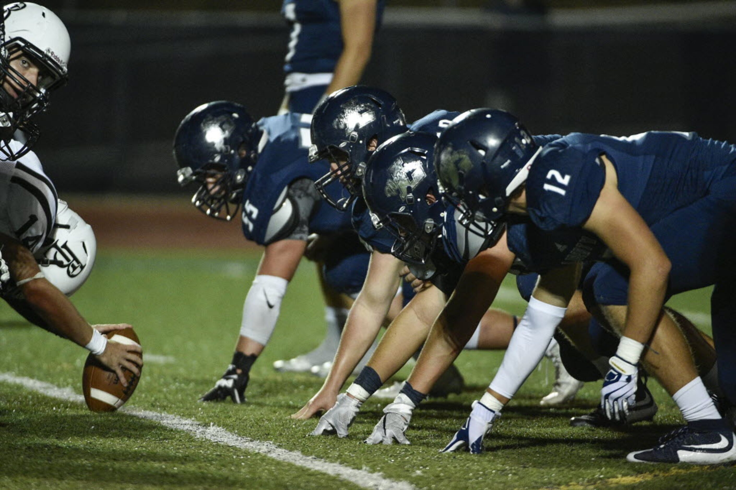 The Liberty punt receiving team readies for the snap during a high school football game at...