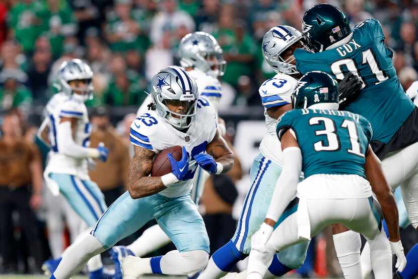 Dallas Cowboys running back Rico Dowdle (23) tries to find room to run against Philadelphia...