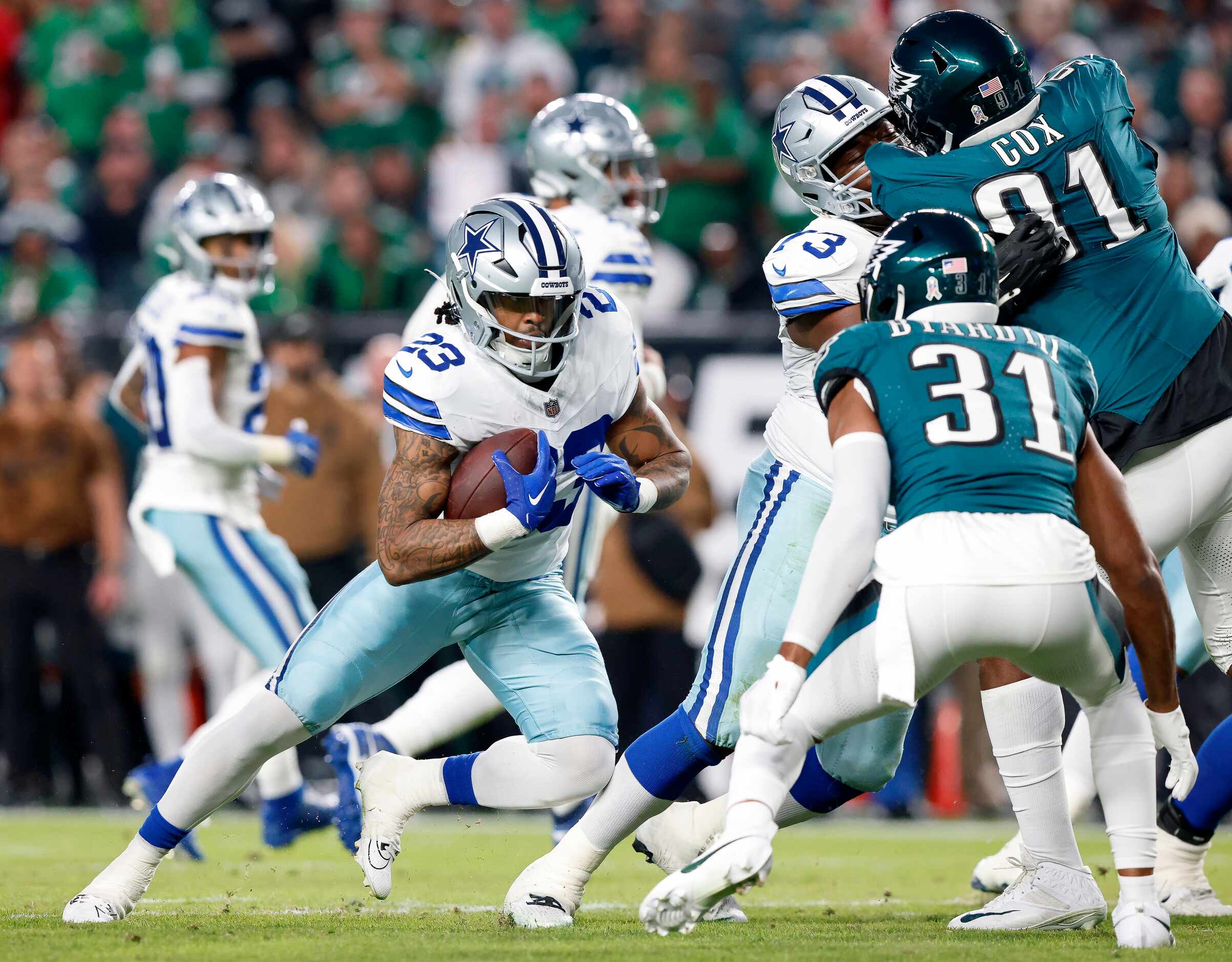 Dallas Cowboys running back Rico Dowdle (23) tries to find room to run against Philadelphia...