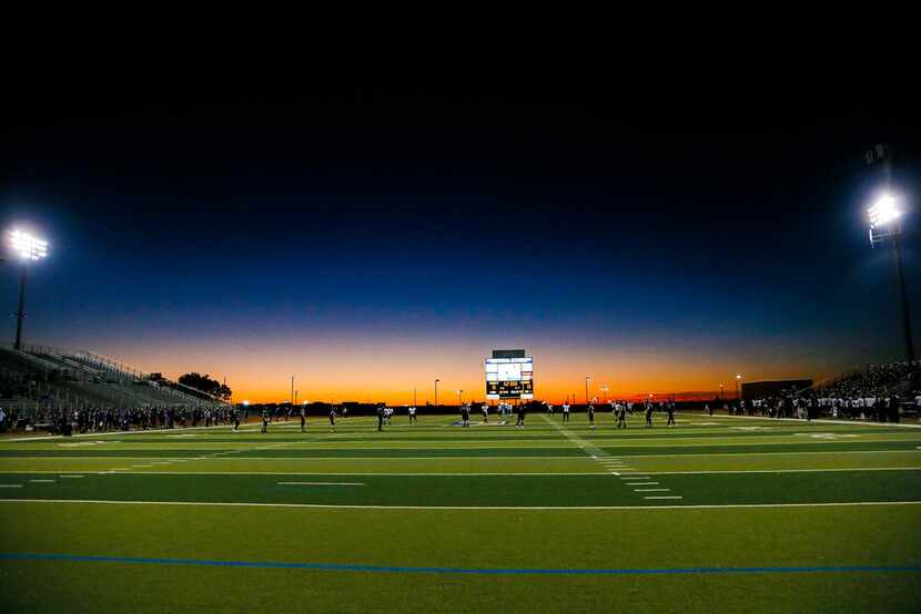 The sun sets as Frisco Independence kicks off to The Colony during the first half of a high...