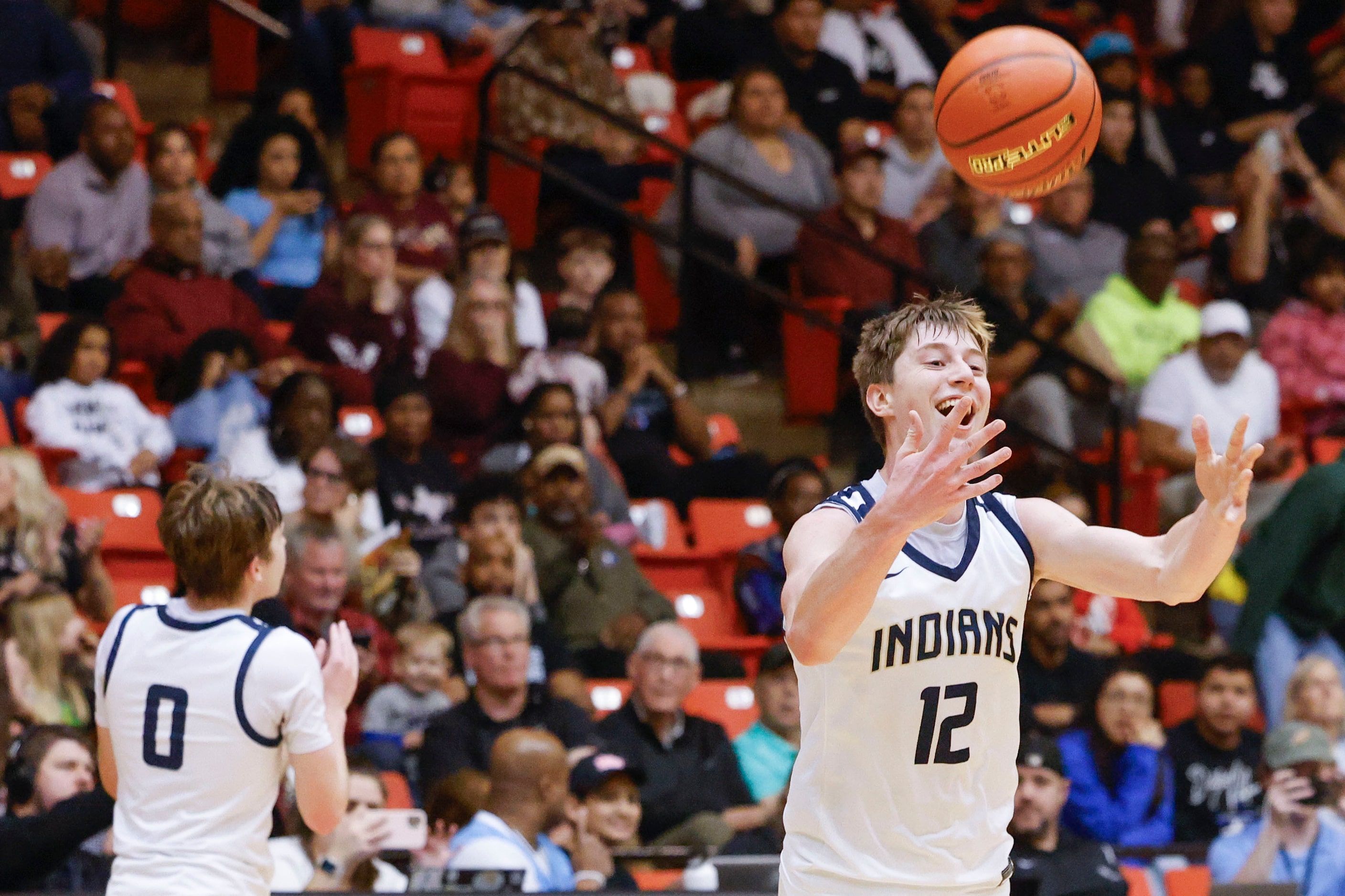 Keller High players including Rhett Schank (right) cheer following their win in the Class 6A...