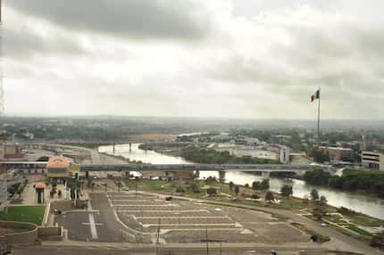 A bridge connects Laredo and Nuevo Laredo. Couriers for Mexican drug cartels are moving tens...
