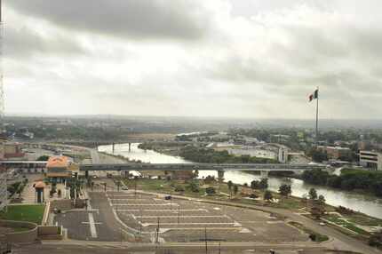 A bridge connects Laredo and Nuevo Laredo. Couriers for Mexican drug cartels are moving tens...