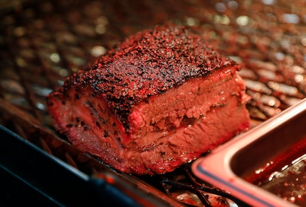 Smoked brisket is one of the specialties at Hutchins BBQ in McKinney. Owner Tim Hutchins...