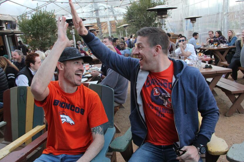 Broncos fans Eric Haugen and Matt Casseday celebrate Denver's first score at the Super Bowl...