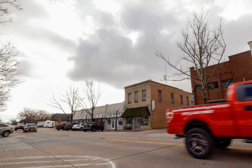 Traffic moves along Main Street in downtown Allen. The city has a new development plan for...