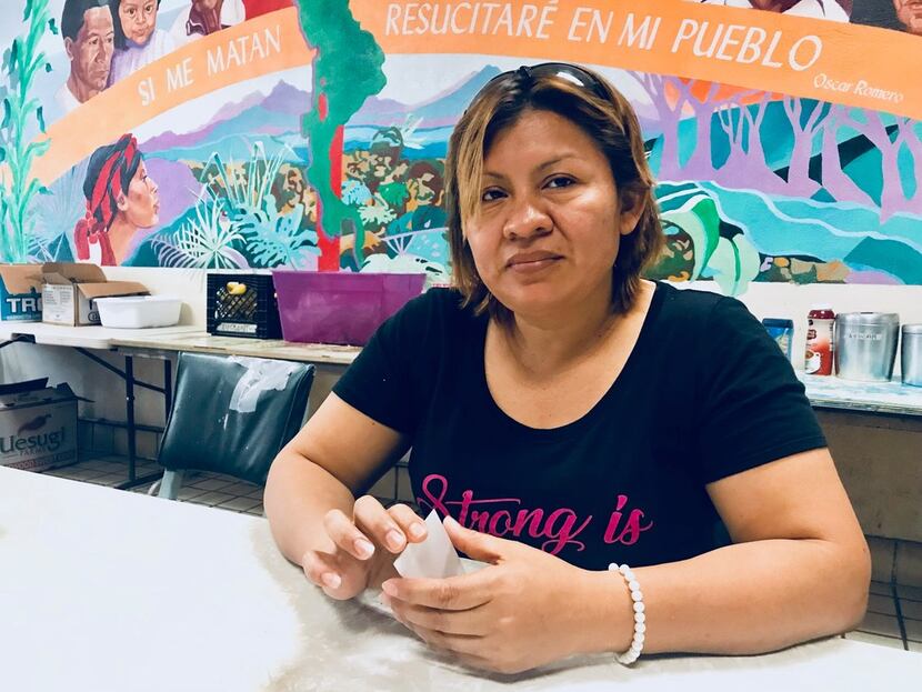Digna Perez, 37, sits at a shelter in El Paso, waiting to be reunited with her children,...