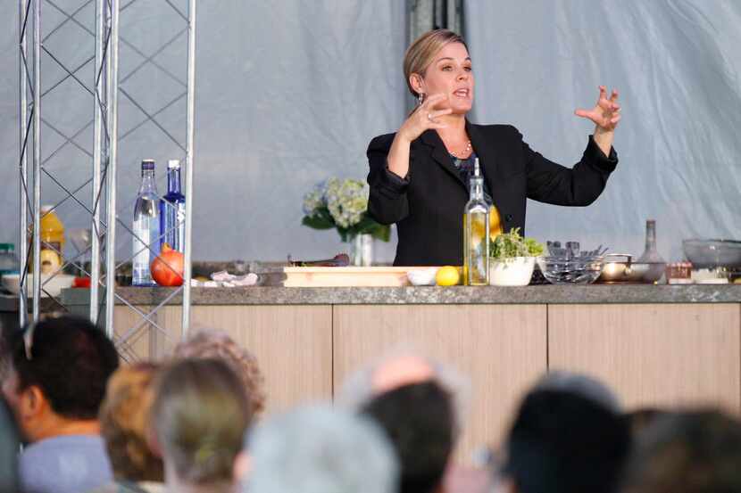 Iron chef Cat Cora demonstrates a cooking class during the Fork & Cork festival Addison...