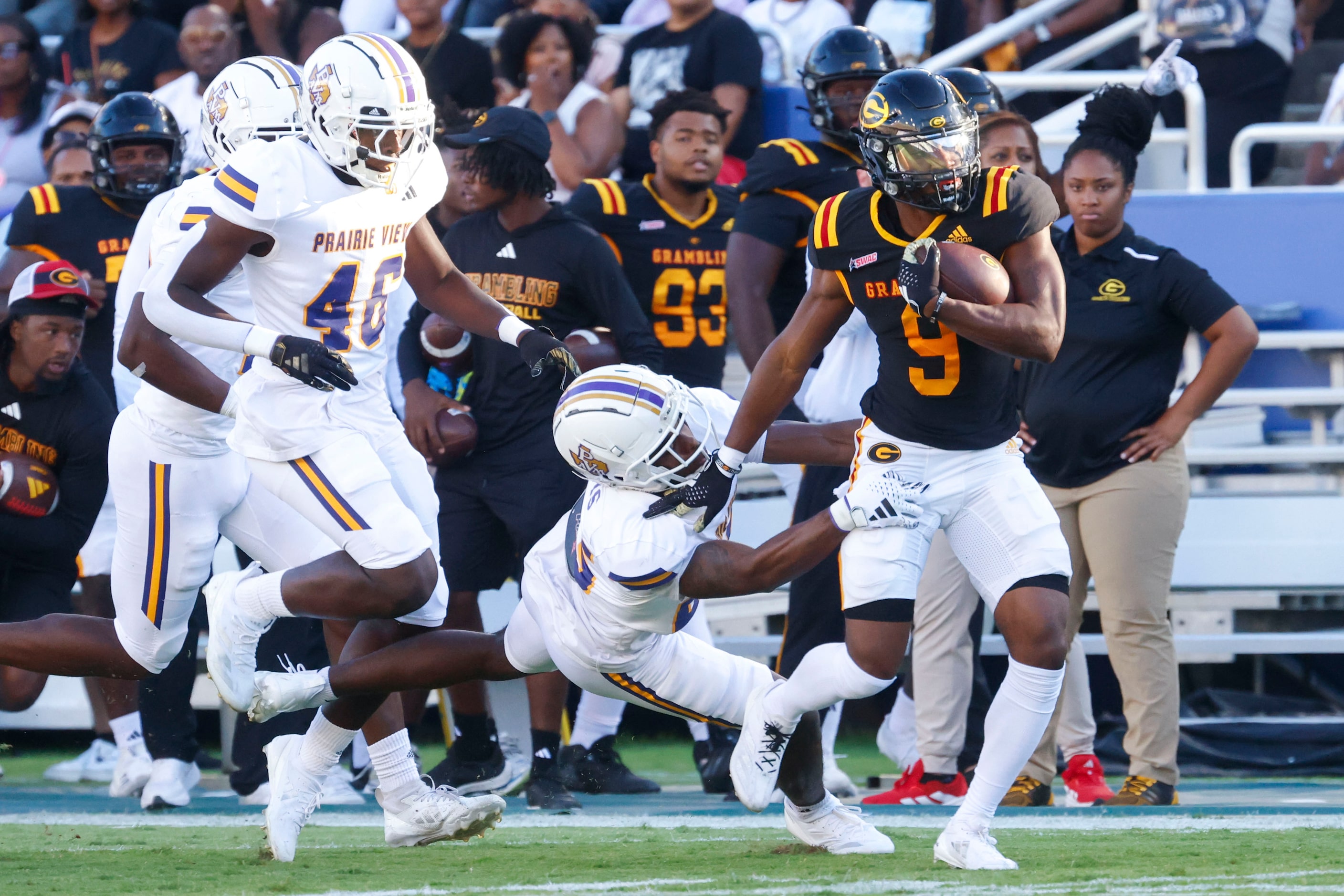 Grambling State running back Ke'travion Hargrove (right) runs past Prairie View A&M...