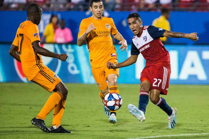 FC Dallas forward Jesus Ferreira (27) makes a pass during the first half of an MLS game...