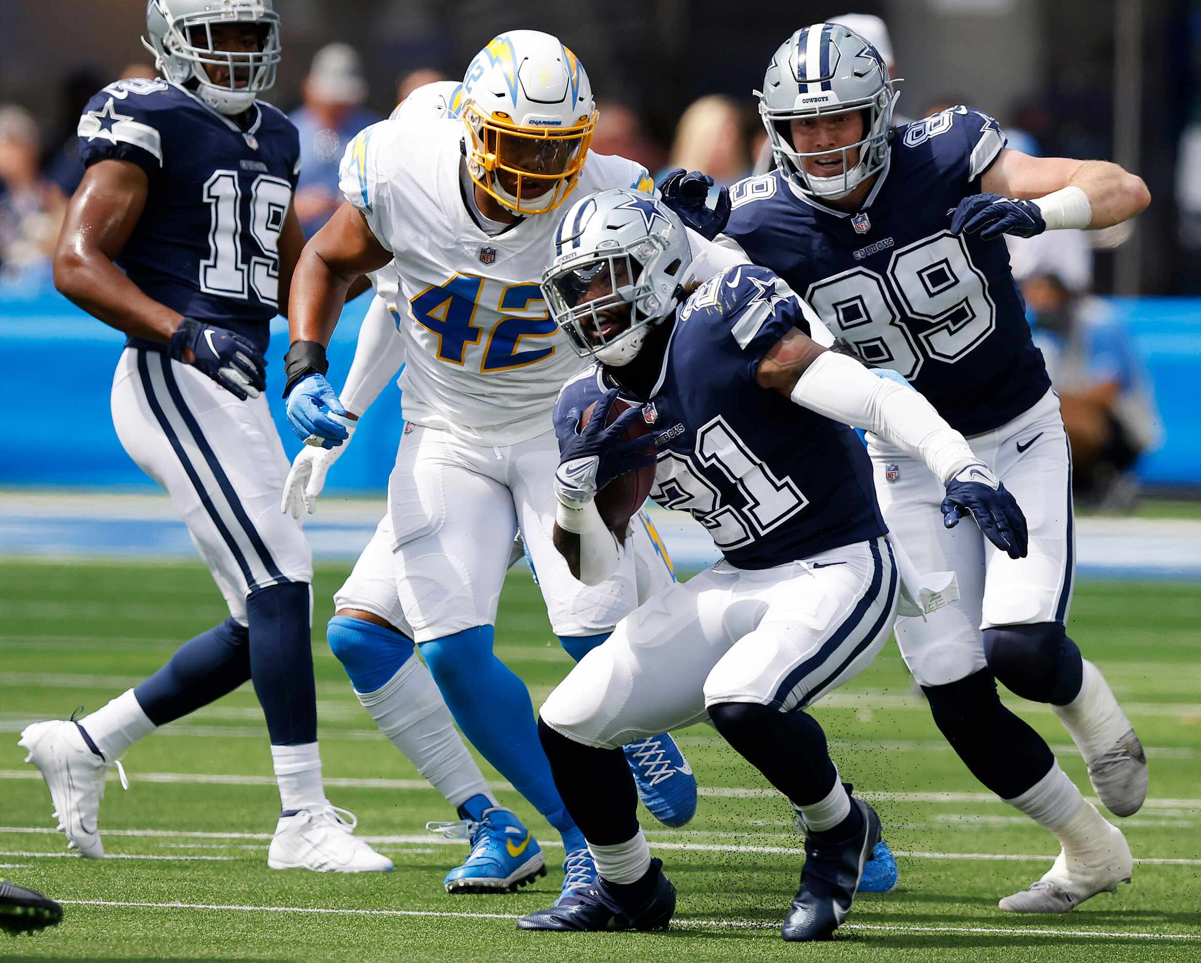 Dallas Cowboys running back Ezekiel Elliott (21) makes a move on the Los Angeles Chargers...