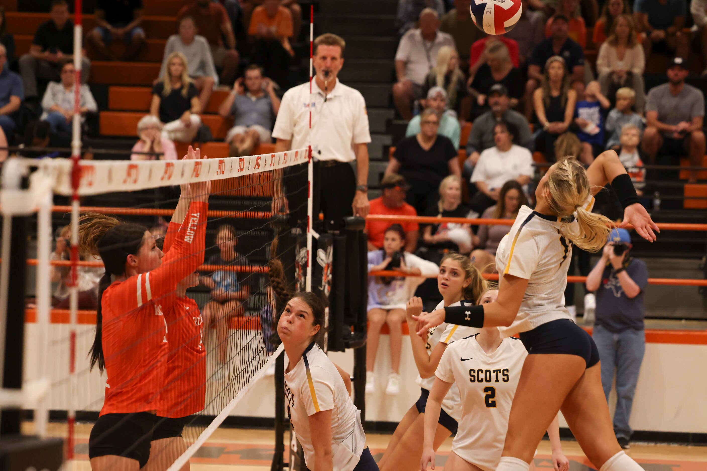 Highland Park High School’s Sydney Breon spikes the ball over the net during the volleyball...