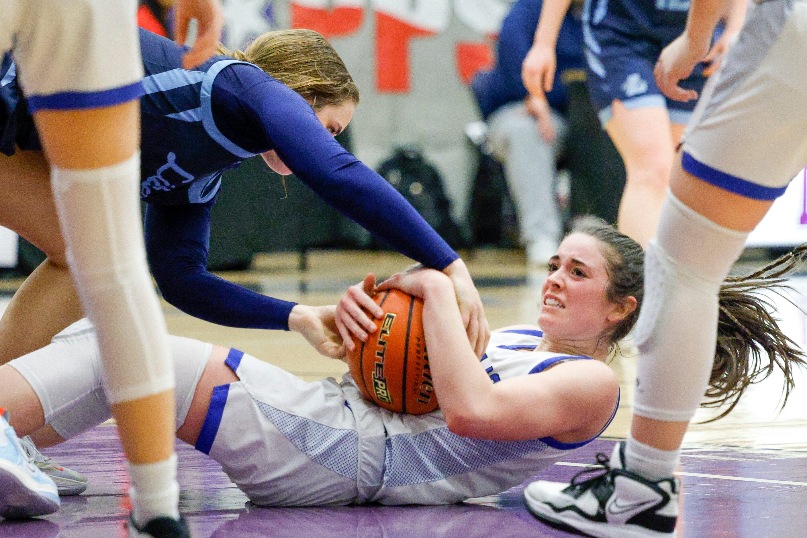 Argyle Liberty Christian guard Marisa Martin (left) and Tyler Grace Community guard Reece...