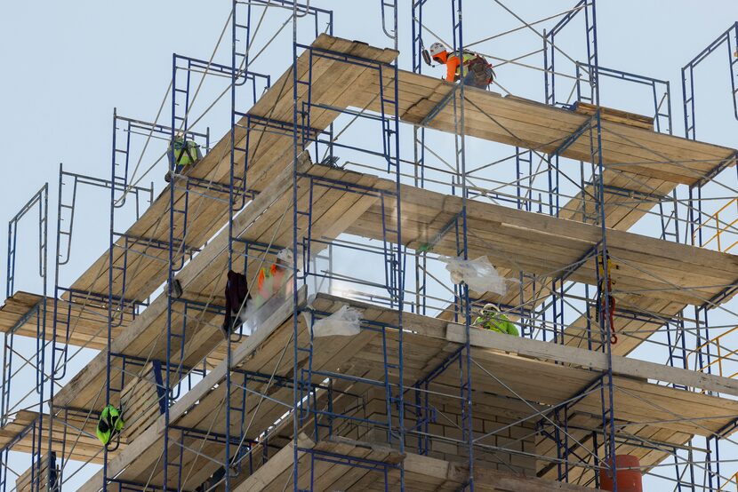 Construction crews working last month on the Stillwater Capital Apartments at 2800 Taylor...