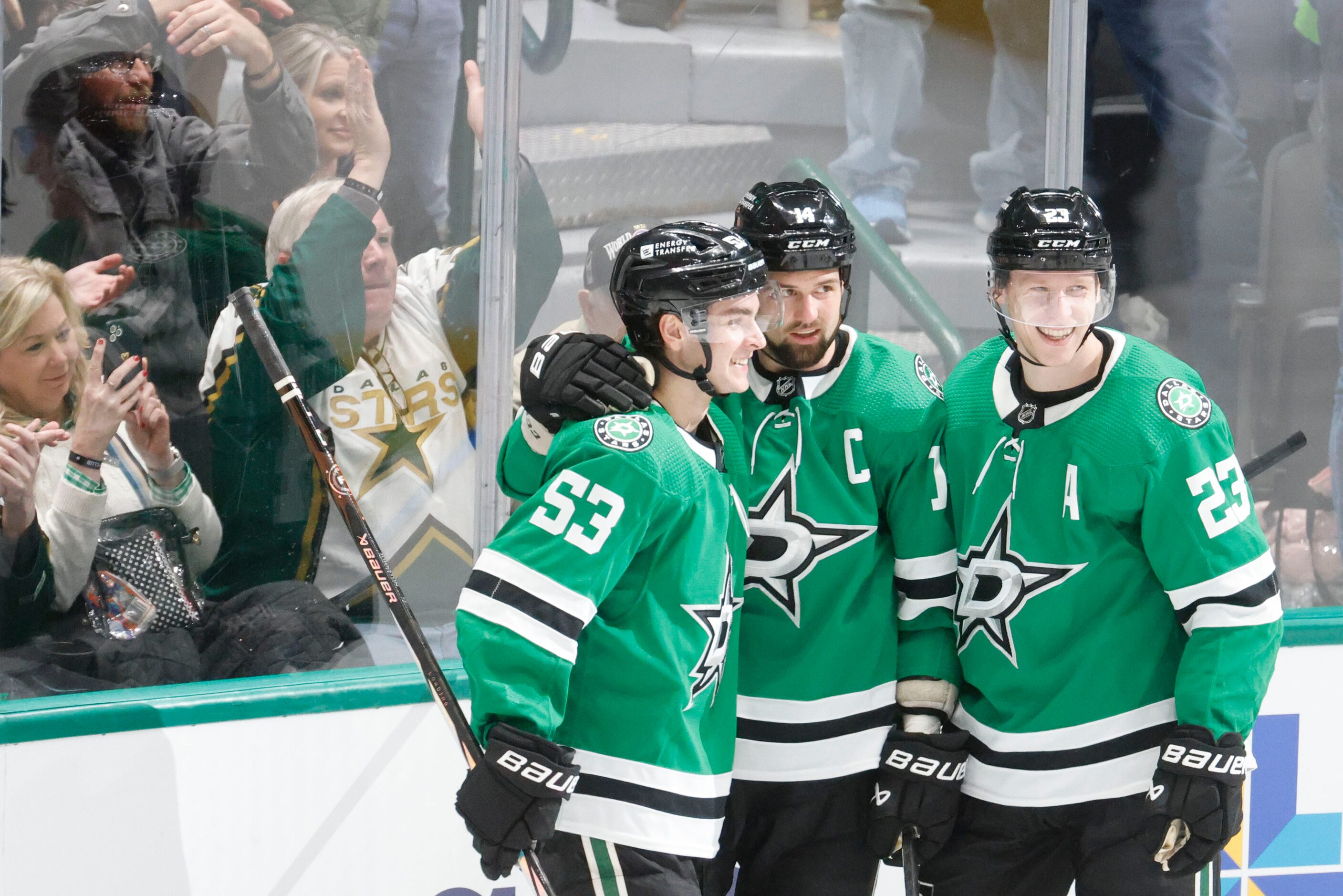 Dallas Stars left wing Jamie Benn (14) celebrates his goal with center Wyatt Johnston (53)...