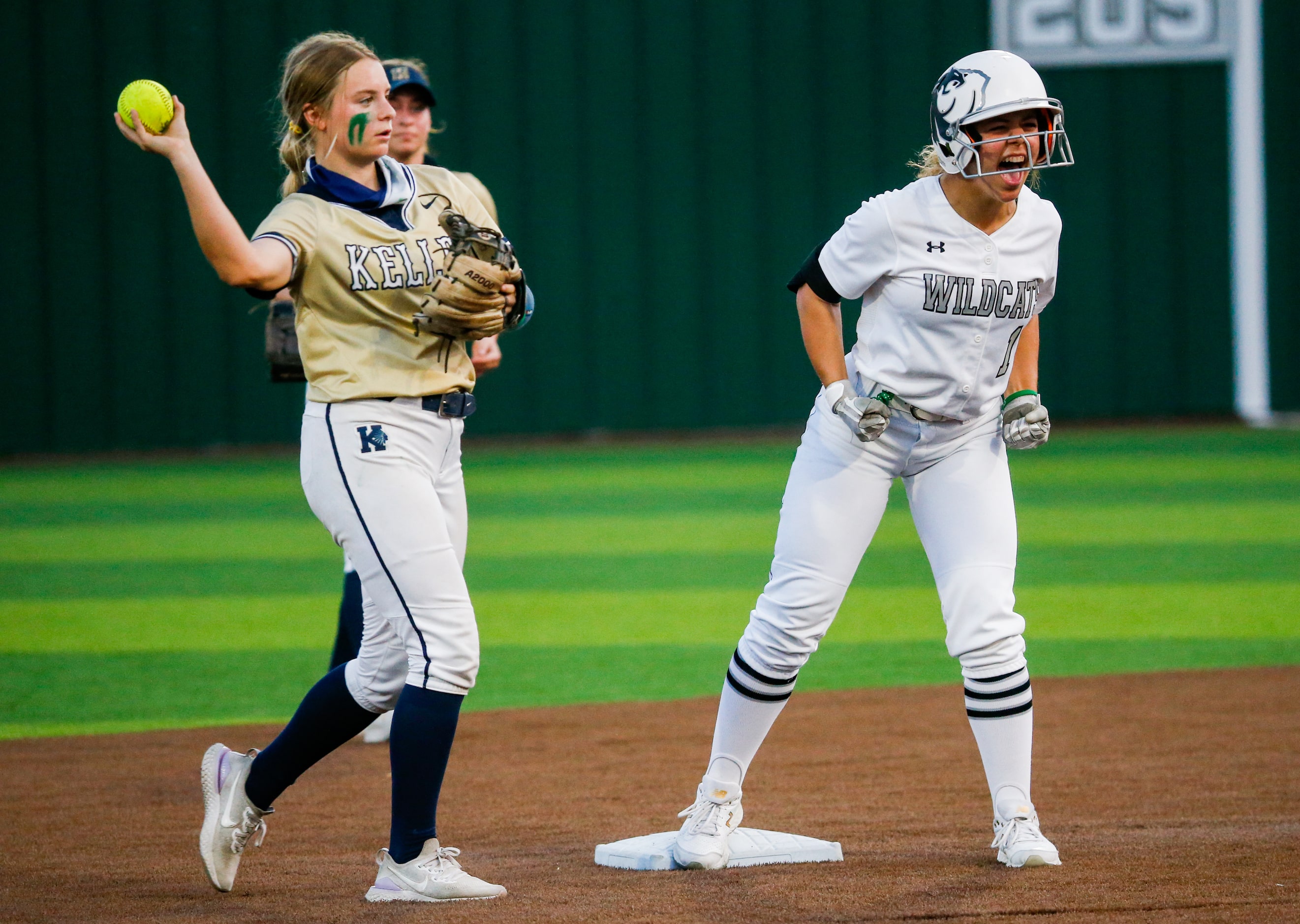 Denton Guyer's Avery Jefferson (1) celebrates a second base hit and her team's first point...