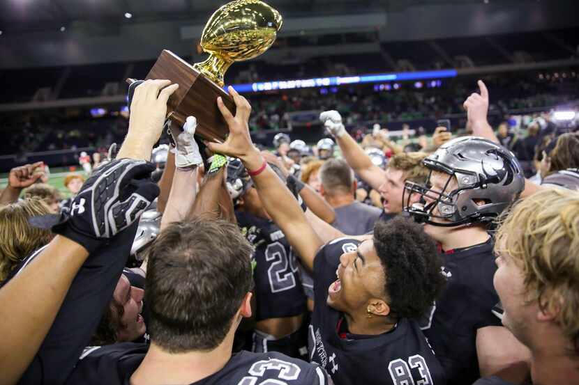 The Denton Guyer Wildcats celebrate after winning a Class 6A Division II Region I semifinal...