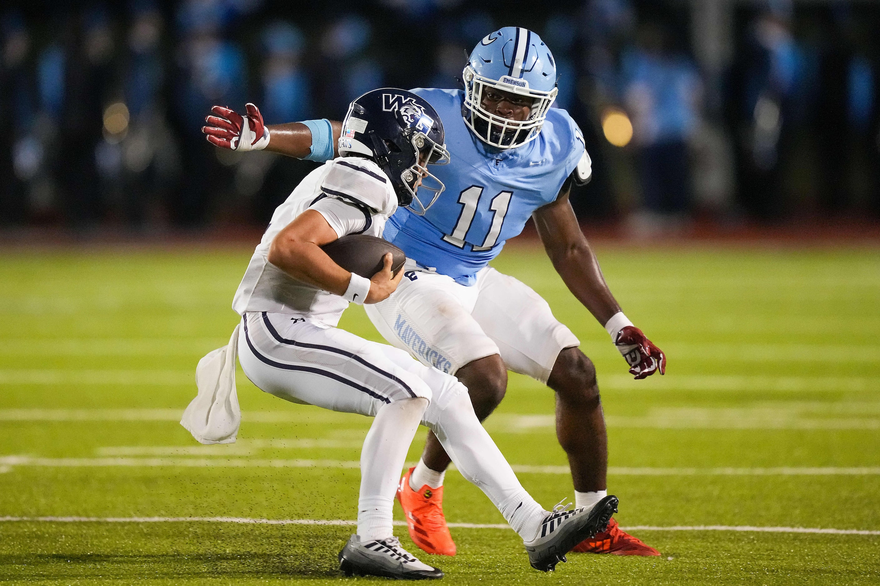 Prosper Walnut Grove quarterback Hayes Hackney (2) is brought down by Frisco Emerson...