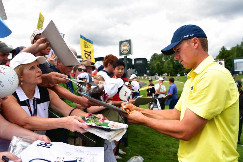 CHARLOTTE, NC - AUGUST 08:  Jordan Spieth of the United States signs autographs for fans...