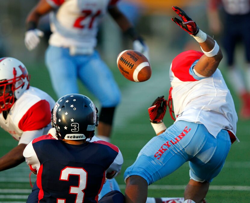 Allen's Nick Hinkley (3) strips the ball away from  Skyline's Andrew Coleman (6) during the...