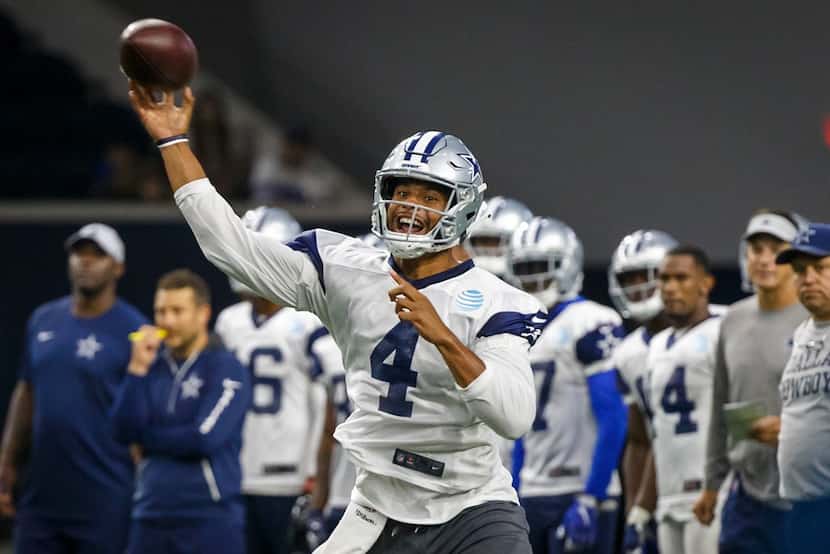Dallas Cowboys quarterback Dak Prescott throws a pass during the team's  training camp...