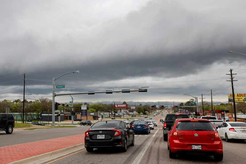 Storm clouds linger over Teasley Lane and Dallas Drive on Thursday, March 16, 2023 in...